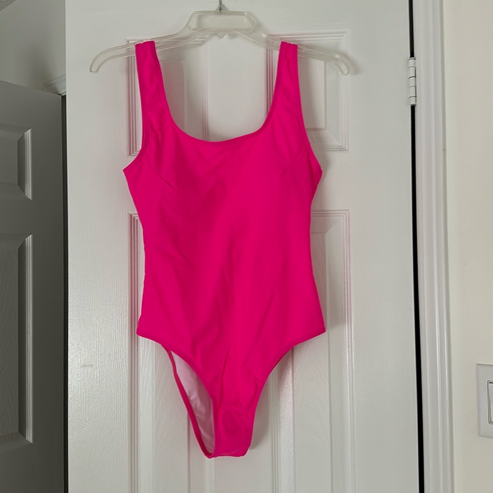 Hot pink one piece, bathing suit with haircut leg